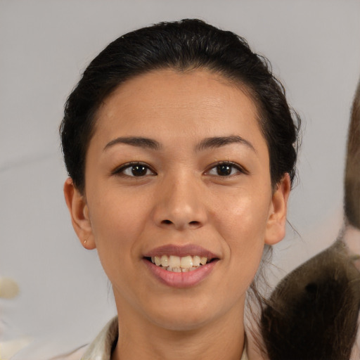 Joyful asian young-adult female with medium  brown hair and brown eyes