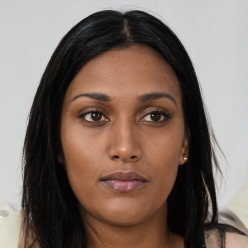 Joyful asian young-adult female with long  black hair and brown eyes