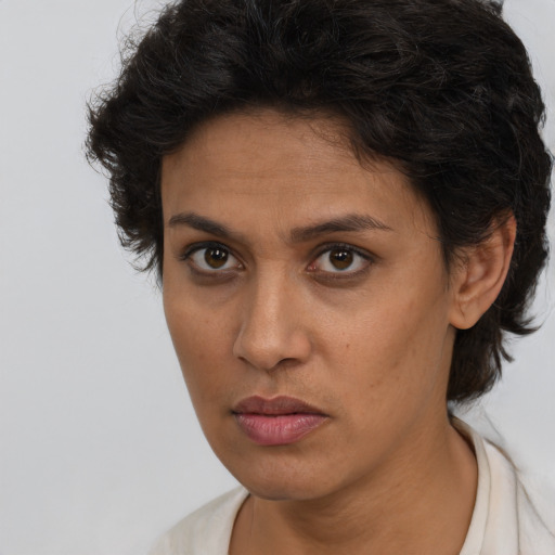 Neutral white young-adult female with short  brown hair and brown eyes