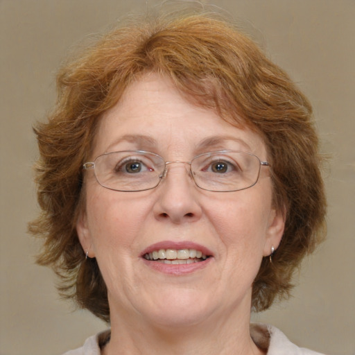 Joyful white middle-aged female with medium  brown hair and blue eyes