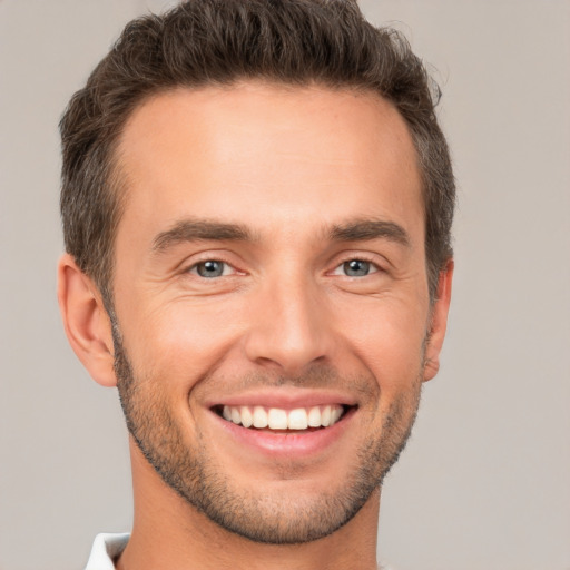 Joyful white young-adult male with short  brown hair and brown eyes