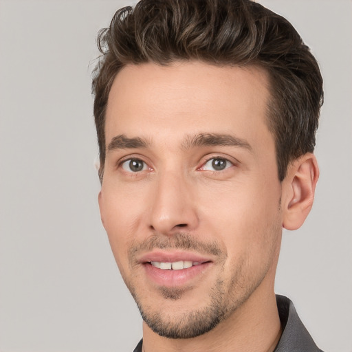 Joyful white young-adult male with short  brown hair and brown eyes