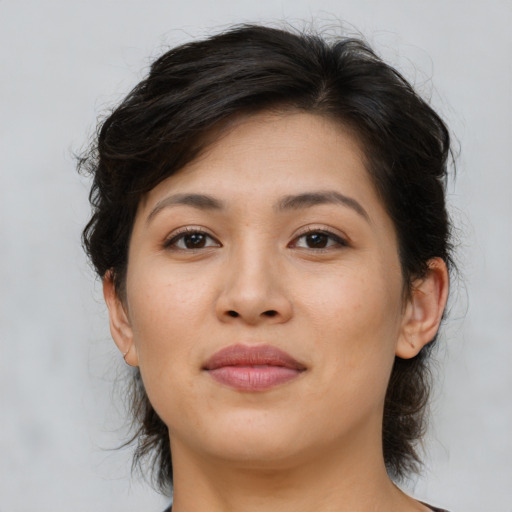 Joyful asian young-adult female with medium  brown hair and brown eyes