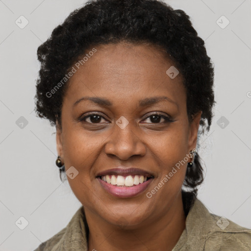 Joyful black young-adult female with short  brown hair and brown eyes