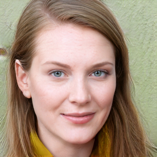 Joyful white young-adult female with long  brown hair and blue eyes