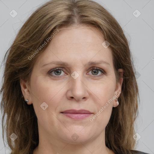 Joyful white adult female with medium  brown hair and grey eyes