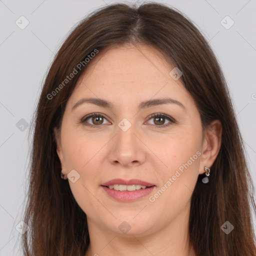 Joyful white young-adult female with long  brown hair and brown eyes