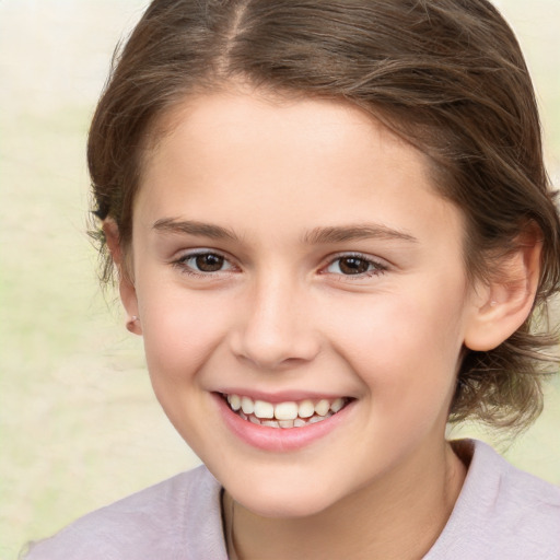 Joyful white child female with medium  brown hair and brown eyes