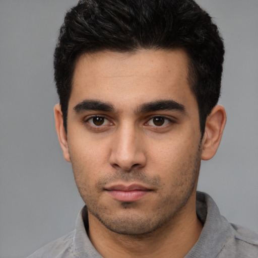 Neutral white young-adult male with short  black hair and brown eyes