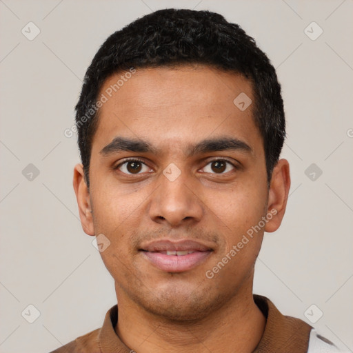 Joyful latino young-adult male with short  black hair and brown eyes