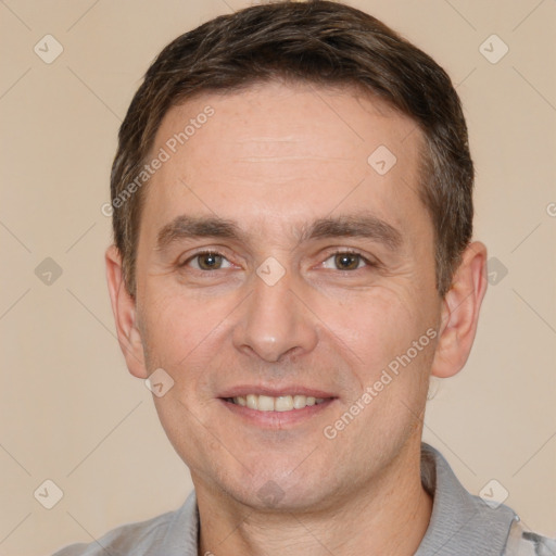 Joyful white adult male with short  brown hair and brown eyes