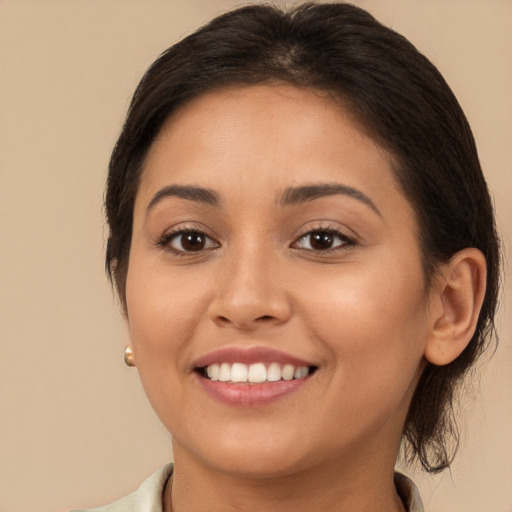 Joyful white young-adult female with medium  brown hair and brown eyes