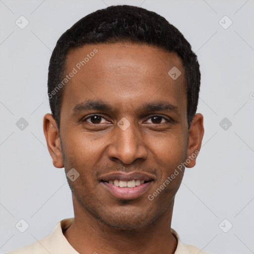 Joyful black young-adult male with short  black hair and brown eyes