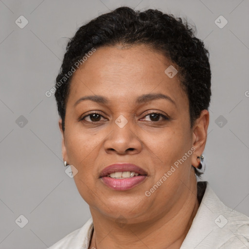 Joyful black adult female with short  brown hair and brown eyes