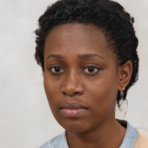 Neutral black young-adult female with short  black hair and brown eyes