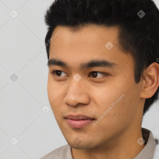 Joyful latino young-adult male with short  black hair and brown eyes