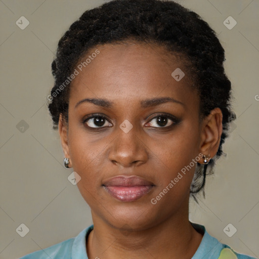 Joyful black young-adult female with short  black hair and brown eyes