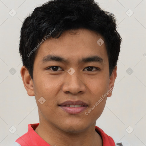 Joyful asian young-adult male with short  black hair and brown eyes