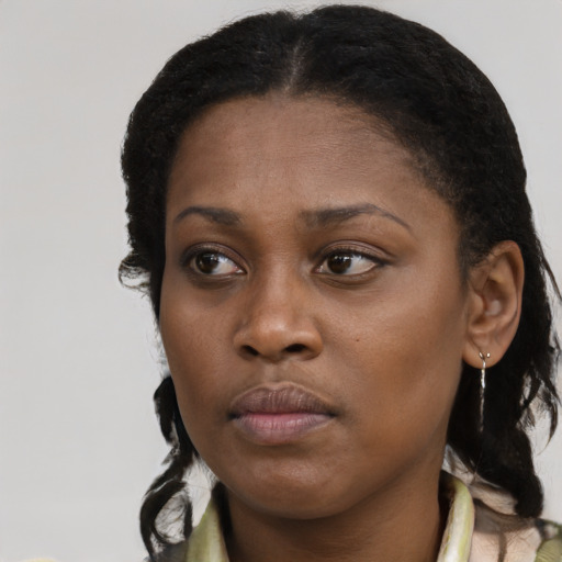 Neutral black young-adult female with medium  black hair and brown eyes