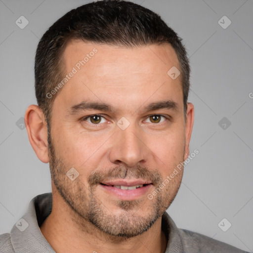 Joyful white adult male with short  brown hair and brown eyes