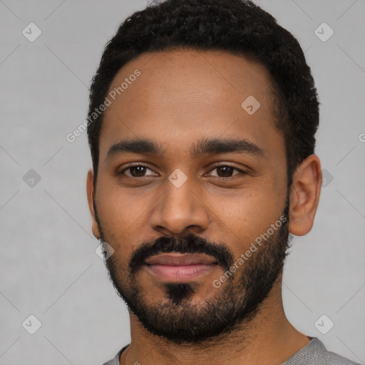 Neutral black young-adult male with short  black hair and brown eyes