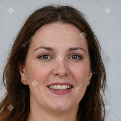 Joyful white adult female with long  brown hair and grey eyes