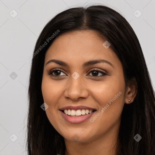 Joyful latino young-adult female with long  brown hair and brown eyes