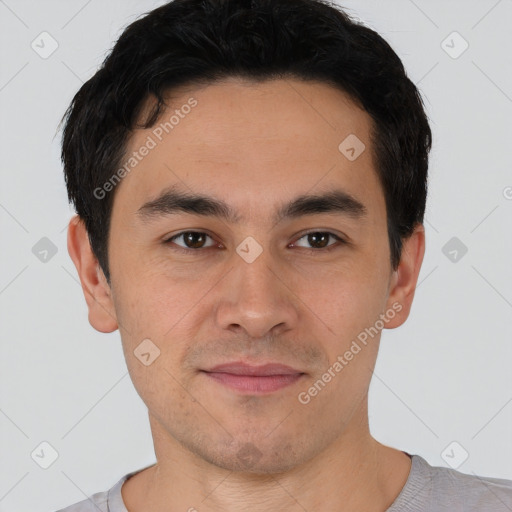 Joyful asian young-adult male with short  black hair and brown eyes