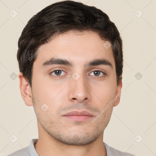 Neutral white young-adult male with short  brown hair and brown eyes