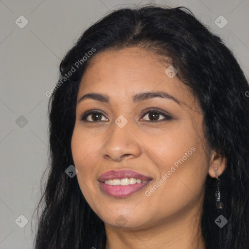 Joyful latino young-adult female with long  black hair and brown eyes