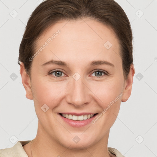 Joyful white young-adult female with short  brown hair and grey eyes