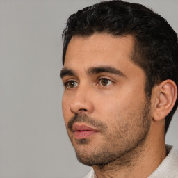 Neutral white young-adult male with short  black hair and brown eyes