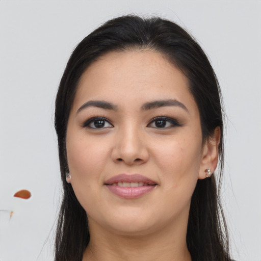 Joyful asian young-adult female with long  brown hair and brown eyes