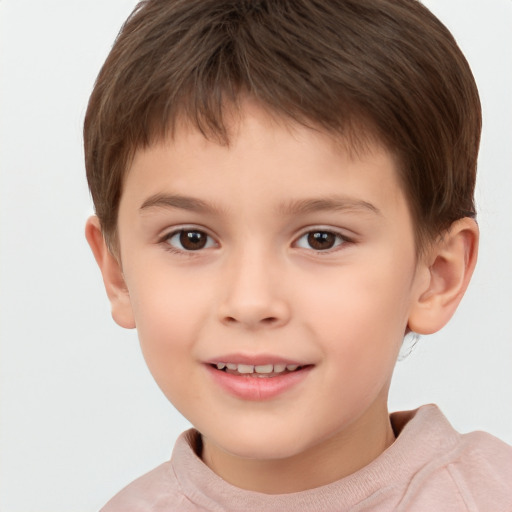 Joyful white child male with short  brown hair and brown eyes