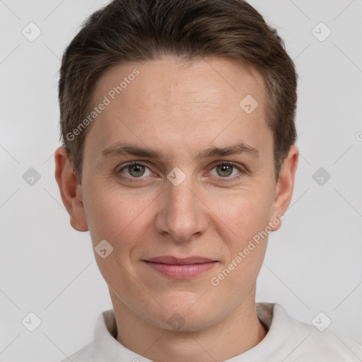 Joyful white adult male with short  brown hair and grey eyes