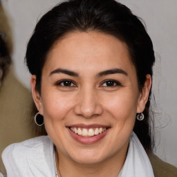 Joyful white adult female with medium  brown hair and brown eyes