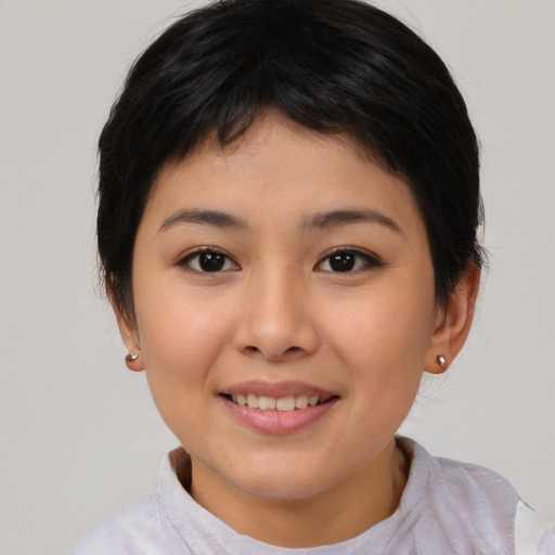 Joyful asian young-adult female with short  brown hair and brown eyes