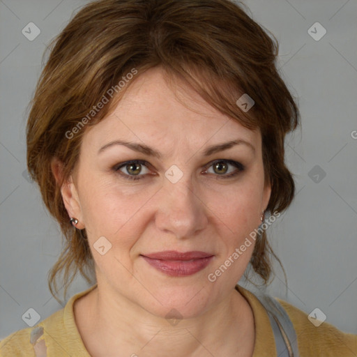 Joyful white adult female with medium  brown hair and blue eyes