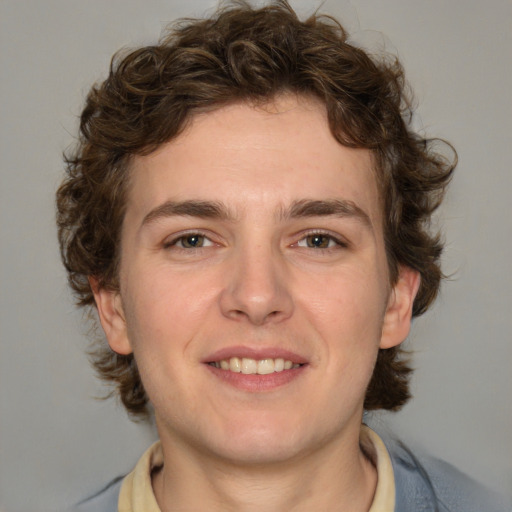 Joyful white young-adult male with medium  brown hair and brown eyes