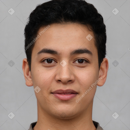 Joyful latino young-adult male with short  brown hair and brown eyes