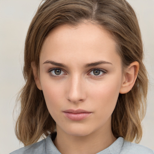 Neutral white young-adult female with medium  brown hair and brown eyes