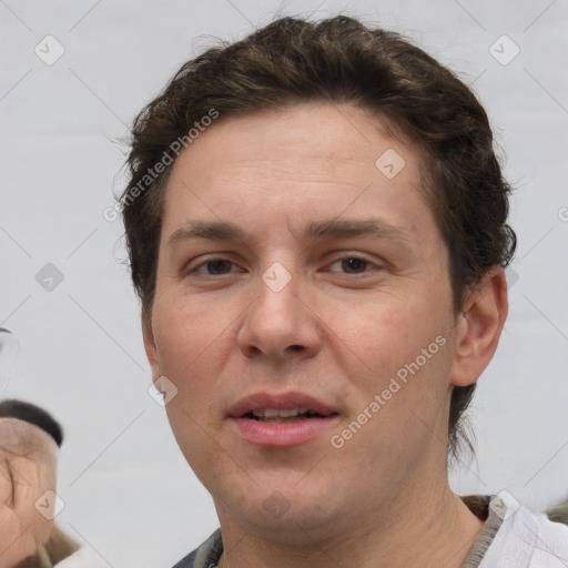 Joyful white adult female with short  brown hair and brown eyes