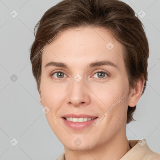 Joyful white young-adult female with short  brown hair and grey eyes