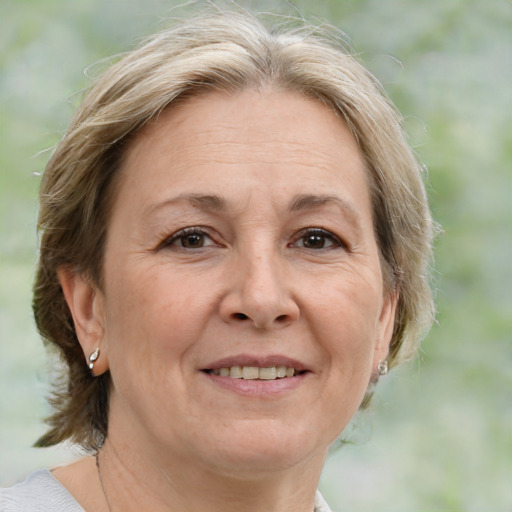 Joyful white middle-aged female with medium  brown hair and brown eyes