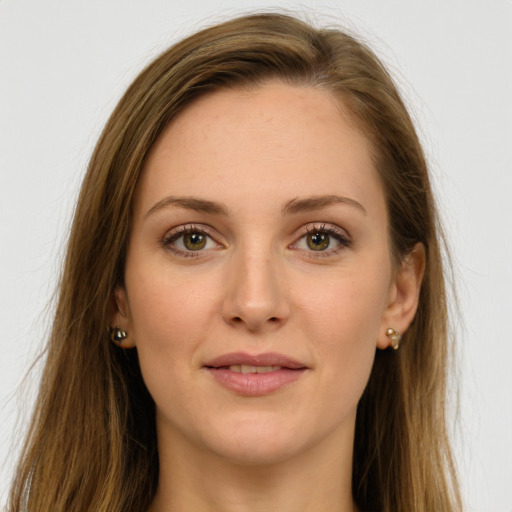 Joyful white young-adult female with long  brown hair and green eyes