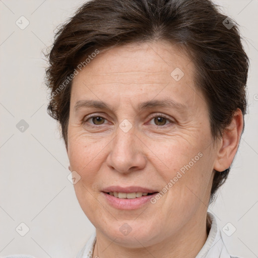 Joyful white adult female with short  brown hair and brown eyes