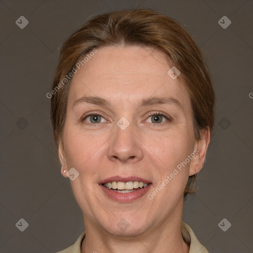 Joyful white adult female with short  brown hair and grey eyes