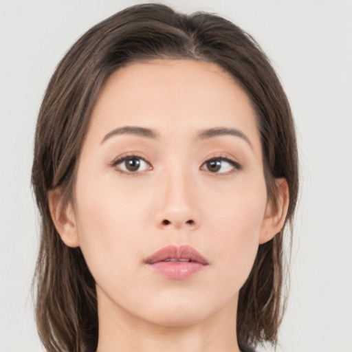 Neutral asian young-adult female with medium  brown hair and brown eyes