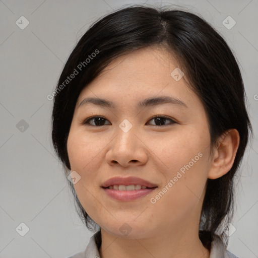 Joyful asian young-adult female with medium  brown hair and brown eyes