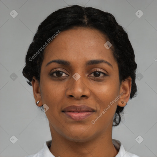 Joyful black young-adult female with short  black hair and brown eyes